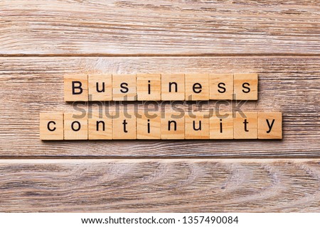 Business Continuity word written on wood block. Business Continuity text on wooden table for your desing, concept.