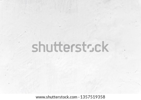 Adobe whitewashed wall in natural white color, traces of brush, background Royalty-Free Stock Photo #1357519358