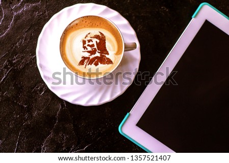 a cup of cappuccino coffee on May 4 with a pattern of a star lord Royalty-Free Stock Photo #1357521407