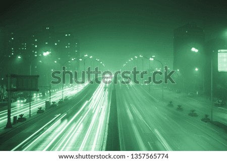 Modern city traffic at night, China, Beijing. Transportation background.