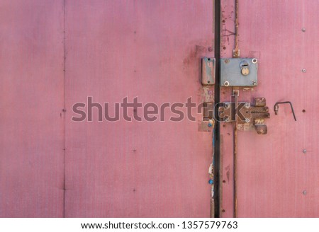 Old lock on the door. lock on the door of an old farmhouse . true village style . close-up. focus on lock