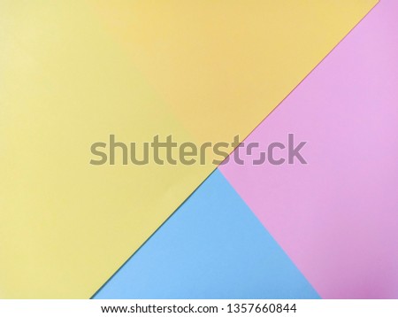 Yellow,blue and pink pastel color paper geometric flat lay background.