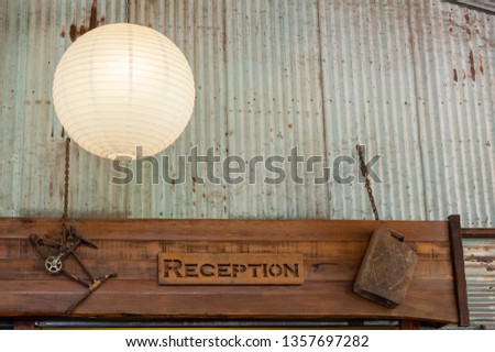 Wooden sign for reception at an outback station in Australia, decorated with rusty ornaments