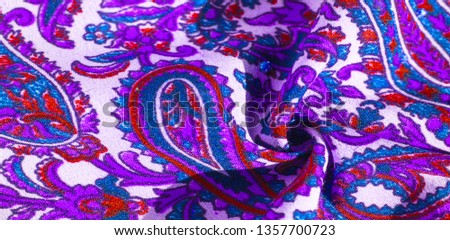 Background texture, pattern, paisley fabric cotton.  Designed by Kaffe Fassett for Free Spirit, the color palette of this large paisley is shades of green with hot pink, cobalt blue, fuchsia and purpl