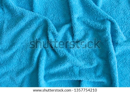 Top view of Blue Towel texture. Blue Towel Fabric Texture Background. Close-up. Blue  natural cotton towel background.Space for text. Hygiene, fabric, laundry,spa and textile concept.
