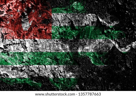 Abkhazia smoky mystical flag on the old dirty wall background
