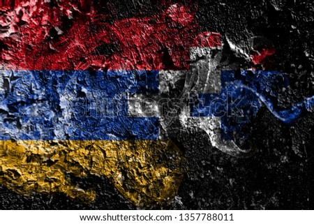 Artsakh smoky mystical flag on the old dirty wall background