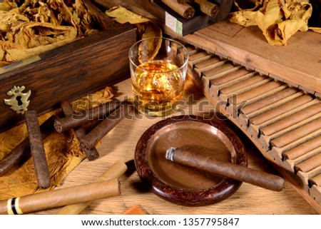 Cigars and Whiskey on wooden Background Royalty-Free Stock Photo #1357795847