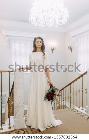 Light wedding photo shoot in European style. The bride before the ceremony at the registry office. 