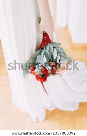 A bright modern bouquet on a white background. Wedding decor and minimalism.