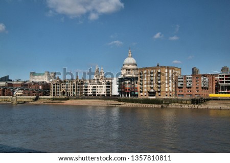 A view of St Pauls across the river Thames
