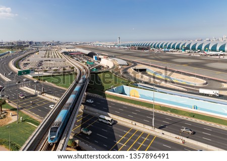Aerial View.Airport Terminal with Airplanes Taxiing and Landing.In Dubai International Airport Royalty-Free Stock Photo #1357896491