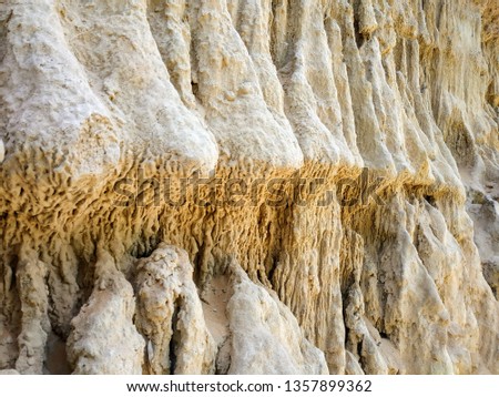 photo cliff. rock near, sand in the desert