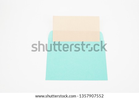 A white letter inside an open envelope isolated on white background