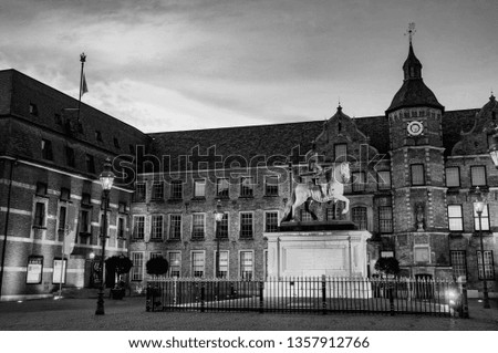 Dusseldorf, Germany. Market Square at night in Dusseldorf, Germany with illuminated historical buildings at sunset. Black and white