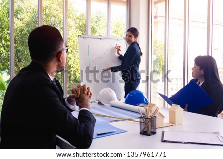 Businessman and team work of  people. They are meeting in office and talking about business.She is present work.united,develop.Photo concept team work and Business.