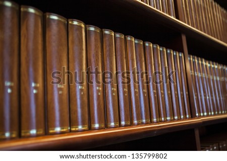 Book shelf in a church library full with brown books