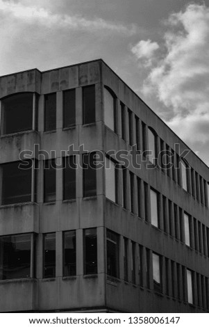Black and White architecture photography. Concrete building with pattern design. Symmetrical building with dark sky and shot with wide angle lens.  