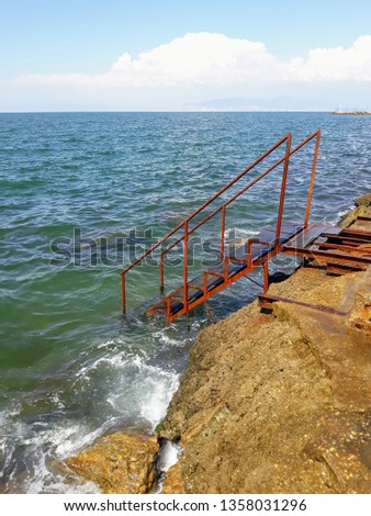 iron staircase to the sea
