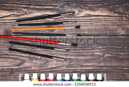 School and art supplies on wooden background