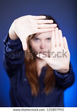 Woman's two hands framing composition forming space