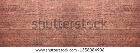 Brick wall pattern background with empty opy space. Elongated old red brickwork texture of vintage grunge house wall front, rough masonry wide backdrop and panorama 