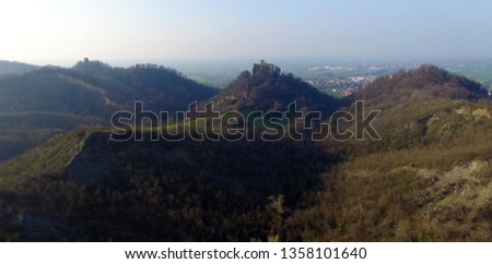 The gullies in the hills of Reggio Emilia near Quattro Castella with the castle of Bianello in the background