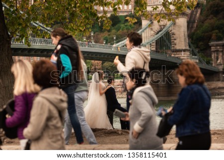 Bride and groom near the bridge in Budapest .Gorgeous wedding couple walking in the old city of Budapest