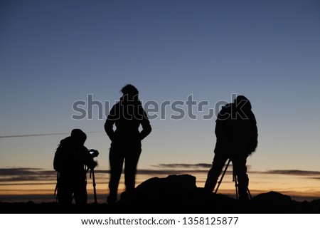 Photographers in the mountain at dawn