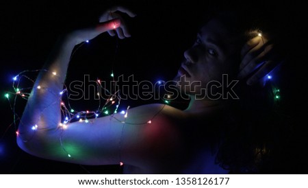 A Boy with Neon Lights in the Dark
