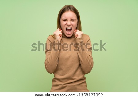 Young woman with turtleneck sweater frustrated by a bad situation