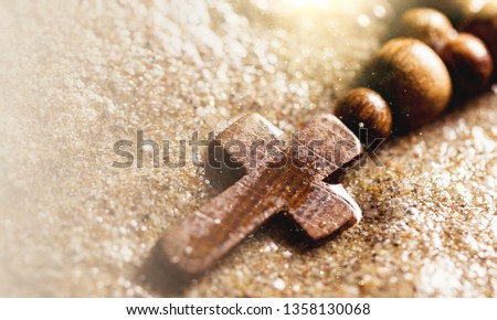 Holy cross on wet surface background