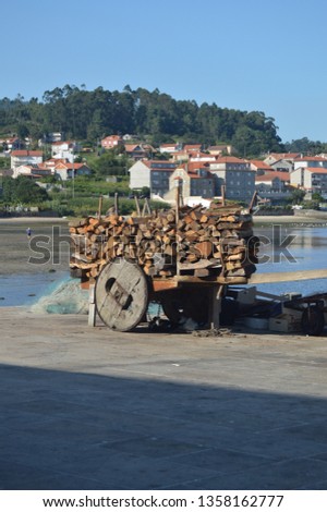 Cart Full Of Firewood Next To The Estuary Of The Beautiful Village Of Combarrro. 