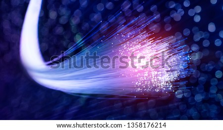 Fiber optics network cable lights abstract background Royalty-Free Stock Photo #1358176214
