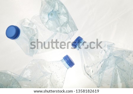 Crumpled empty plastic PVC bottles, studio shot. Plastic pollution concept. 