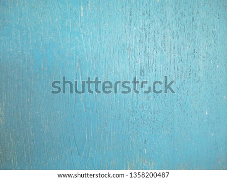 The surface of the blue wood is used as a background.