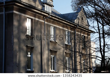 Destroyed facade of a residential building built before World War II. Central Europe