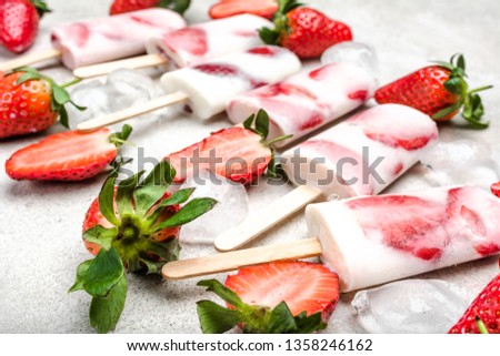 Fruit popsicle with frozen strawberry and yogurt, ice cream on stick