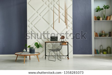 Modern room, decorative background, stone wall blue decoration, working and study table, middle table, vase of plant and grey bookshelf style.