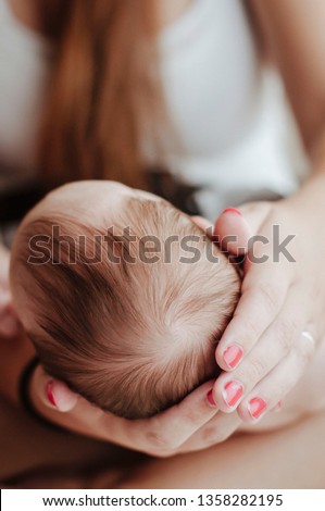 baby in mothers hands soft