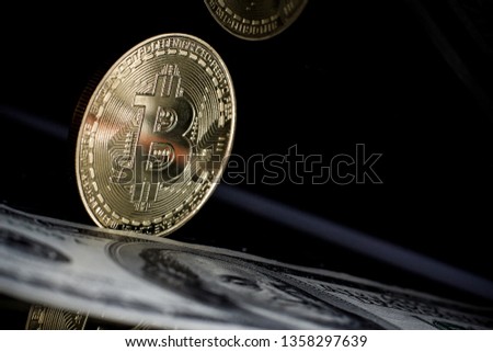Golden Bitcoin and one hundred dollars