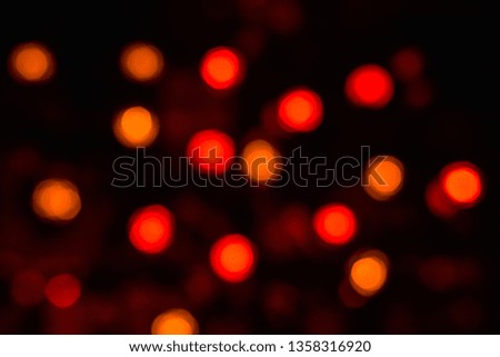 Colorful bokeh with neon lights at night time, motion movement with traffic light in the city on car windshield view, blurred light background. Speed fast with driving car. Long exposure.