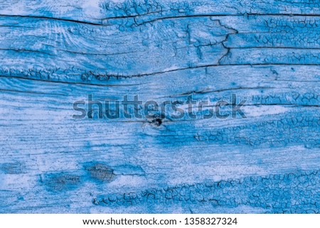 Texture of a blue old board or plank with peeling paint. Abstract background for design.