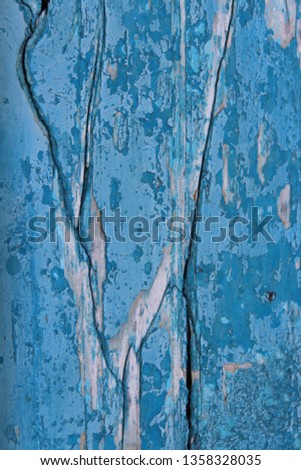Wood Surface with Turquoise Peeling Paint.