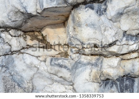 Relief marble wall with a crack