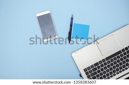 Office supplies on blue background