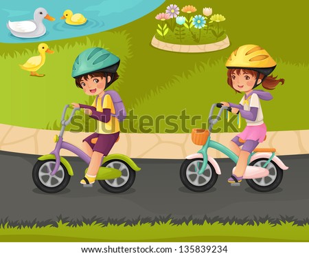 Cute boy and girl riding bikes in the park.
