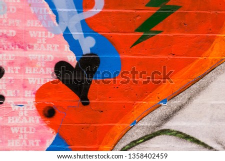 Vibrantly painted brick closeup abstract texture background.