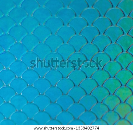 Blue and green  fish scales or hologram mermaid geometric pattern background.