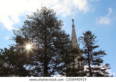 Country church with trees and blue sky